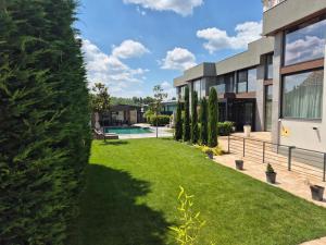 an image of a house with a yard at Diwine Spa House Fruška Gora in Irig