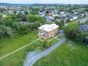 an aerial view of a large house in a residential neighborhood at Auberge La Seigneurie in Matane