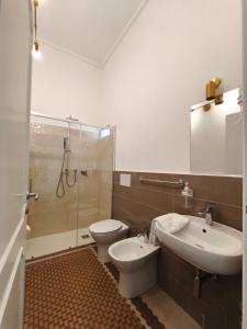 a bathroom with a toilet and a sink and a shower at Palazzo San Giorgio 1924 in Scilla +104 photos