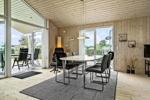 a dining room with a table and chairs at 30042-Malling-Peter-Eriksens-Vej-20 in Malling