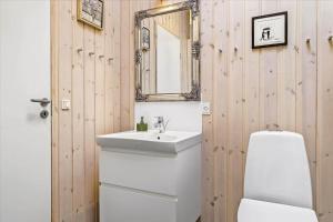 a bathroom with a white sink and a mirror at 30042-Malling-Peter-Eriksens-Vej-20 in Malling +19 photos