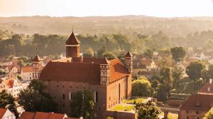 a view of a town with a castle at KAJKl 15 in Lidzbark Warmiński