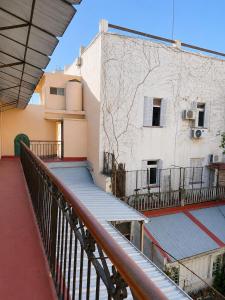 a balcony of a building with a stairway at Hotel Histórico San Telmo in Buenos Aires +16 photos