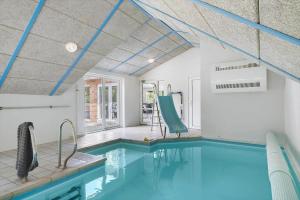 an indoor swimming pool with blue ceilings at 1056-Klegod-Lyngvejen-10 in Klegod