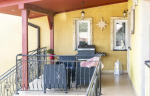 a balcony with a table and a star on the wall at Pokoje Mirów1A in Mirów