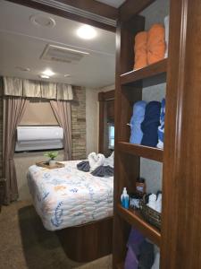 a bedroom with a bed in a room with shelves at Tiki Cabana at Key Largo in Key Largo +25 photos