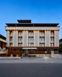 a building with a parking lot in front of it at Seaking Suites-MG Road in Cochin +17 photos