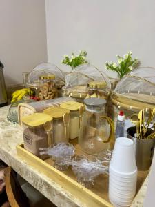 a counter with a bunch of food items on it at Hotel Matinha in Campinorte