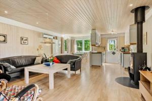a living room with a couch and a table at 30061-Malling-Morbaervaenget-18 in Malling