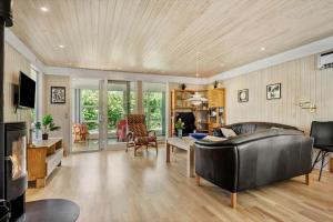 a living room with a couch and a table at 30061-Malling-Morbaervaenget-18 in Malling