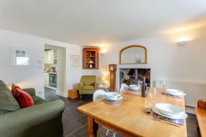 a living room with a wooden table and a couch at 2 Bed in Strath oc-s44223 in Gairloch