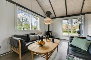 a living room with a table and a couch at C11704-Hemmet-Rylevaenget-33 in Hemmet