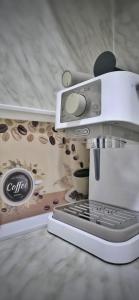a coffee machine sitting on top of a counter at Apartman Doboj in Doboj