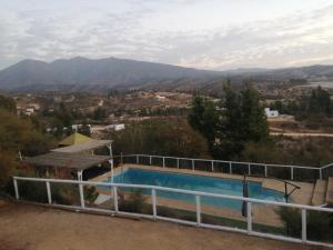 a swimming pool with a view of the mountains at Oceana Suites Limache con piscina in Limache +25 photos