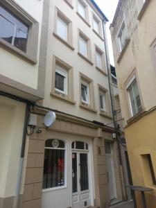 a building with a door in front of it at Casa de la Soledad 3 in Lugo