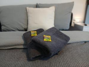 a bed with two pillows on top of it at City Hub Room 22 - mit Balkon - Coffee for free - in Karlsruhe
