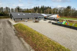 an aerial view of a house with a playground at C11694-Hemmet-Klydevaenget-1 in Hemmet