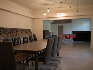 a conference room with a table and chairs at Margaráta Vendégház in Soltvadkert