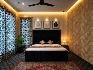 a bedroom with a large bed and two curtains at Younis Guest house in Srinagar