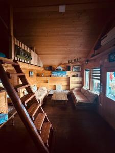 an inside view of a room with benches and stairs at Vikendica Eldar, Ada Bojana in Ulcinj