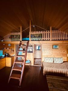 a room with two bunk beds and a kitchen at Vikendica Eldar, Ada Bojana in Ulcinj