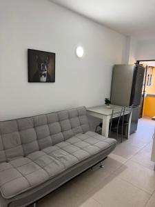 a living room with a couch and a table at Urban Stay Maspalomas in San Bartolomé
