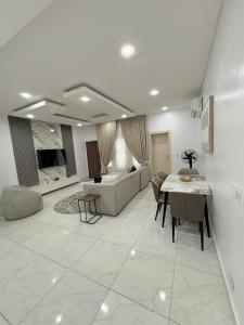 a living room with a table and a couch at Executive Apartment in Anthony in Lagos
