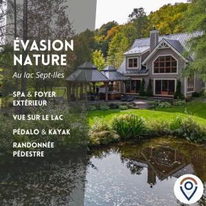 a house with a pond in front of it at Waterfront with VIEW and SPA in Saint-Raymond