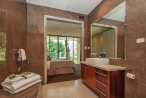 a bathroom with a sink and a mirror at Centenary Peaks in Bright