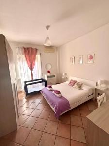 a bedroom with a large bed and a window at La Dolce Vita in Bracciano