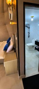 a room with a bathroom with a sink and a toilet at Olivia Rum Luxury Bubbles & Jeep Tours in Wadi Rum