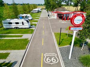 an aerial view of a parking lot with a camping sign at SCANDINAVIA Camping in Zator