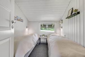 a bedroom with two beds and a window at C11726-Hemmet-Vester-Faelled-120-E1 in Hemmet +18 photos