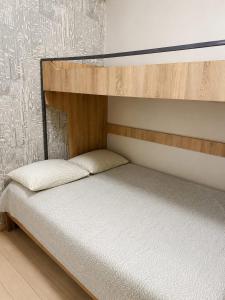a bunk bed in a room with aermott at Cozy apartment in Angisa
