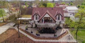 an overhead view of a house with a roof at Vadvirág Villa in Soltvadkert
