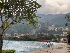 a view of a body of water with a city at Studio 4pax SunshineKekloksiView in Ayer Itam