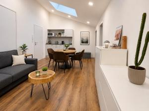 a living room with a couch and a table at Jagdhof Apartments am Spitzingsee in Schliersee