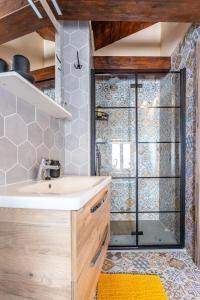 a bathroom with a sink and a shower at House Morski brk in Trogir