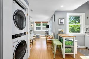 a laundry room with a washer and dryer at Cape Cod Cottage near Beaches & Downtown in Chatham +31 photos
