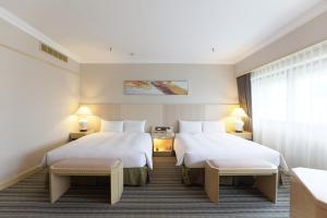 Voodi või voodid majutusasutuse Santos Hotel toas