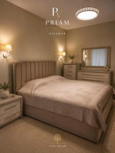 a bedroom with a large bed and a mirror at Valamar Priam Villa D11 in Hamallë +6 photos