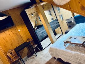 an overhead view of a room with a bed and a table at Agro Bieszczady 2 in Czarna