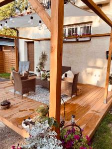 a wooden deck with chairs and a table at Agro Bieszczady 2 in Czarna