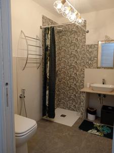 a bathroom with a toilet and a sink at Podere il Gallo Agriturismo in Campiglia Marittima +33 photos