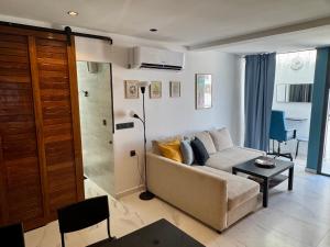 a living room with a couch and a table at Magnifique appartement Bahia Smir Fnideq Mdiq nord in Fnidek +21 photos