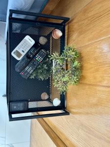 a door with a remote control and some plants at Magnifique appartement Bahia Smir Fnideq Mdiq nord in Fnidek