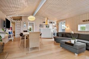 a living room with a couch and a table at 30040-Beder-Hogevaenget-27 in Beder +23 photos