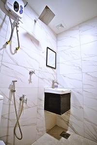 a bathroom with a shower and a sink at Hotel EcoStay at Chow kit in Kuala Lumpur +42 photos