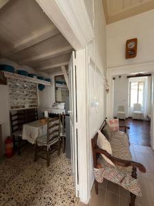 a living room with a table and a dining room at Marthas Traditional House in Symi