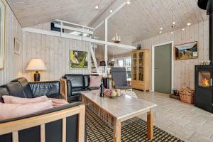 a living room with a couch and a table at C11266-Hemmet-Egernvej-10 in Hemmet